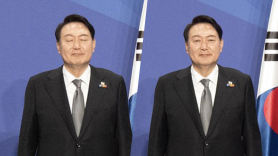 尹 '눈 뜬' 사진으로 나토 홈피 교체…대통령실 "작은 실수"